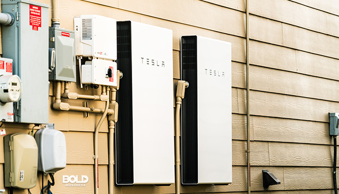 a photo of a house with Tesla Powerwall 2, in relation to Tesla rooftop solar shingles