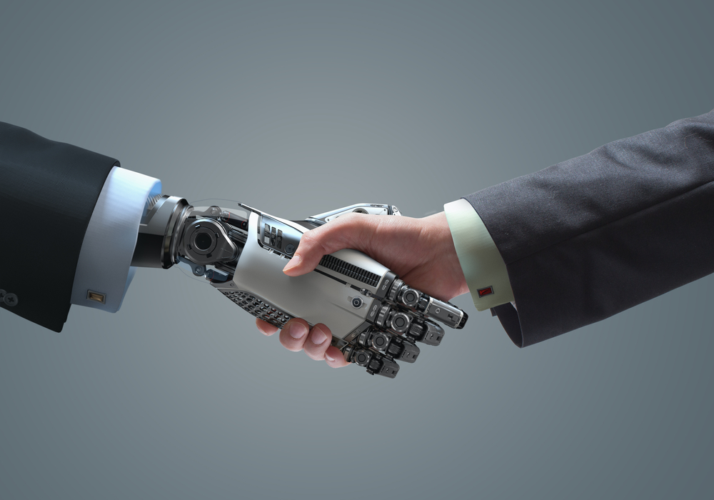 robot hand and a human hand in a handshake amid the possible reality of a robot CEO in the future a robot hand and a human hand in a handshake amid the possible reality of a robot CEO in the future