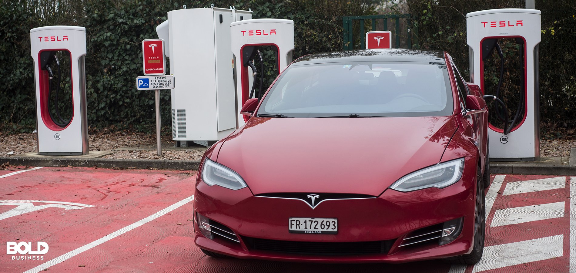 A Tesla car at the pump designed by Elon Musk.