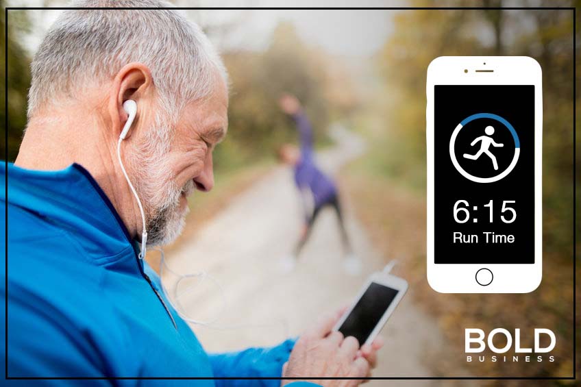 a photo of a male senior citizen with his smartphone while pausing from his trail run, in relation to discussions about healthcare for senior citizens