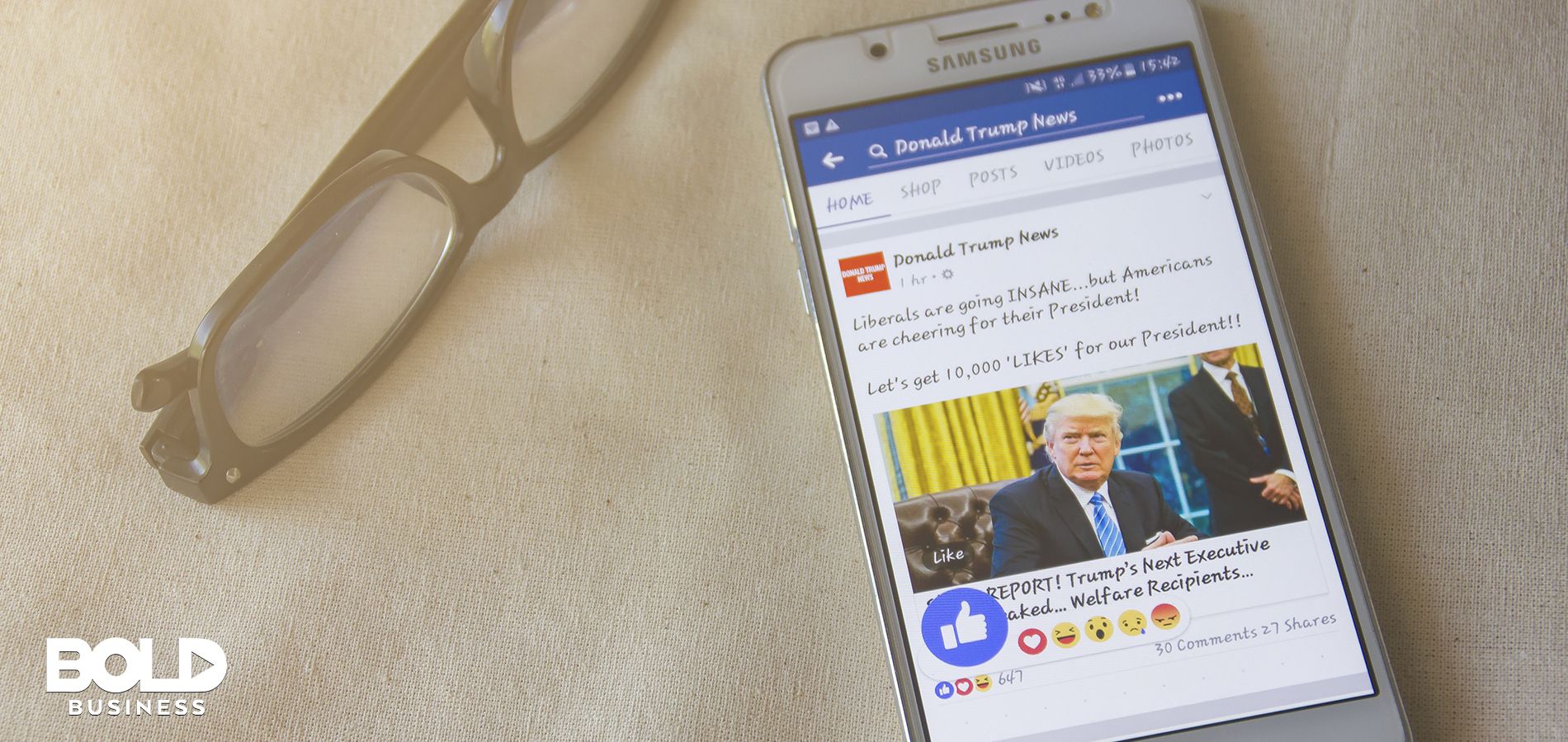 A phone with a Facebook news feed showing, The Trust Project is countering fake news!