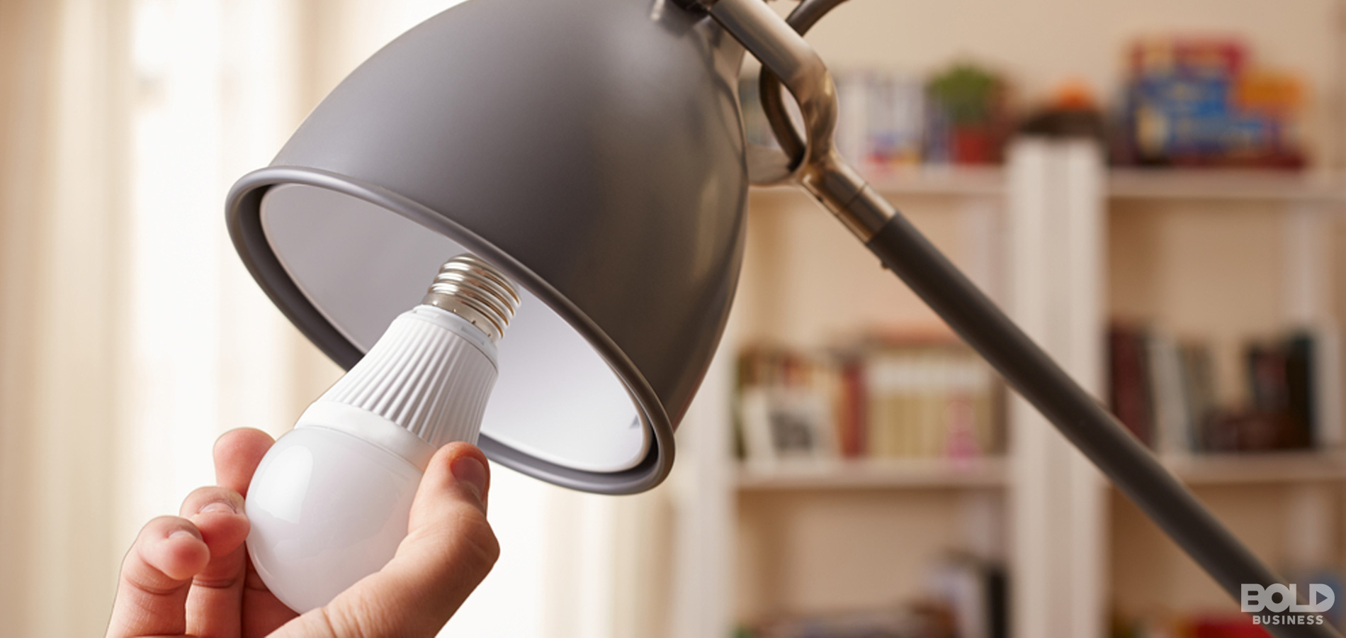 photo of a lamp shade with its light bulb being removed by a hand in connection to the topic of LED light pollution a photo of a lamp shade with its light bulb being removed by a hand in connection to the topic of LED light pollution