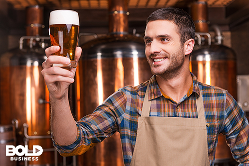 Brewer holding a craft beer