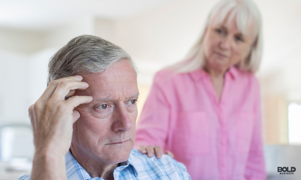 Alternative treatments for alzheimer's: elderly couple with the woman comforting the man