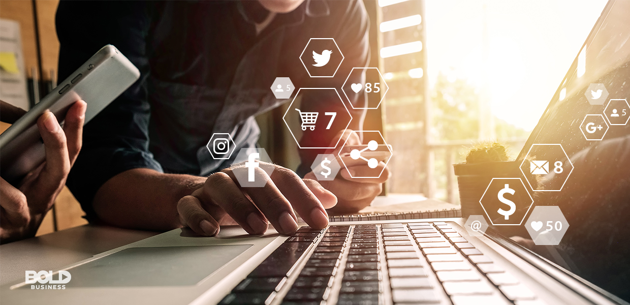 a photo of a person's hand texting on a phone and another person's hand typing on a laptop keyboard in the midst of how brands the connect with consumers