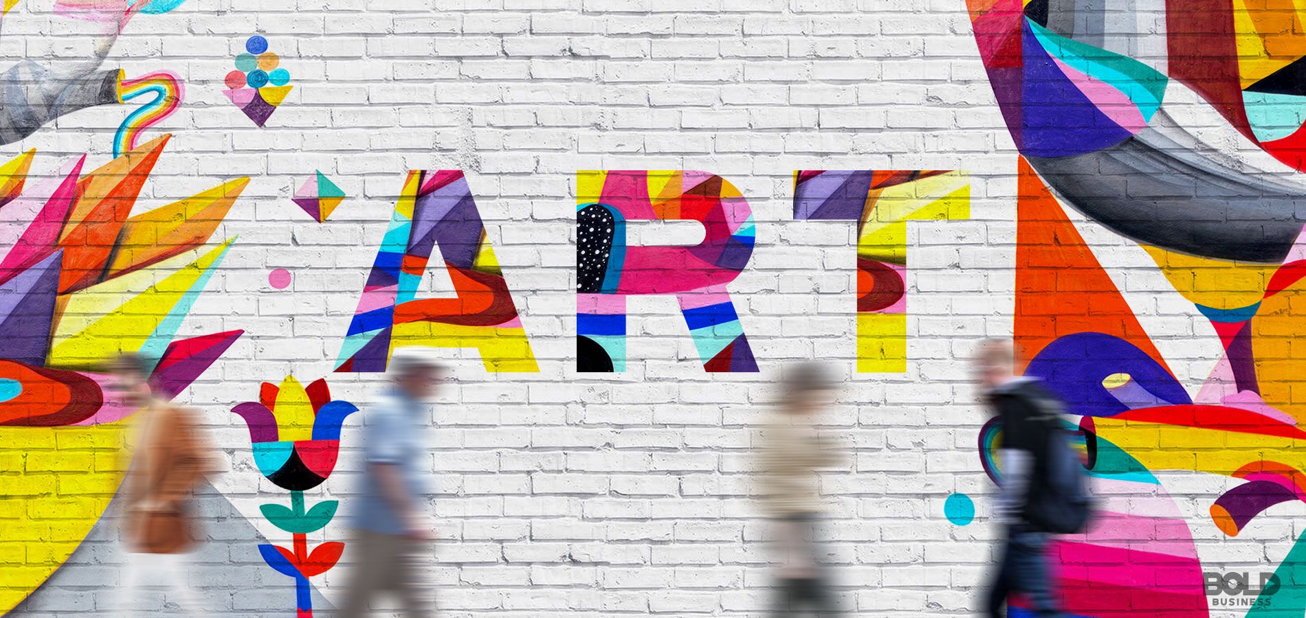 A photo of the word "ART" in different colors set on a gray brick wall reflecting - Art and Its Impact on Society: Art Districts Revitalizing Communities