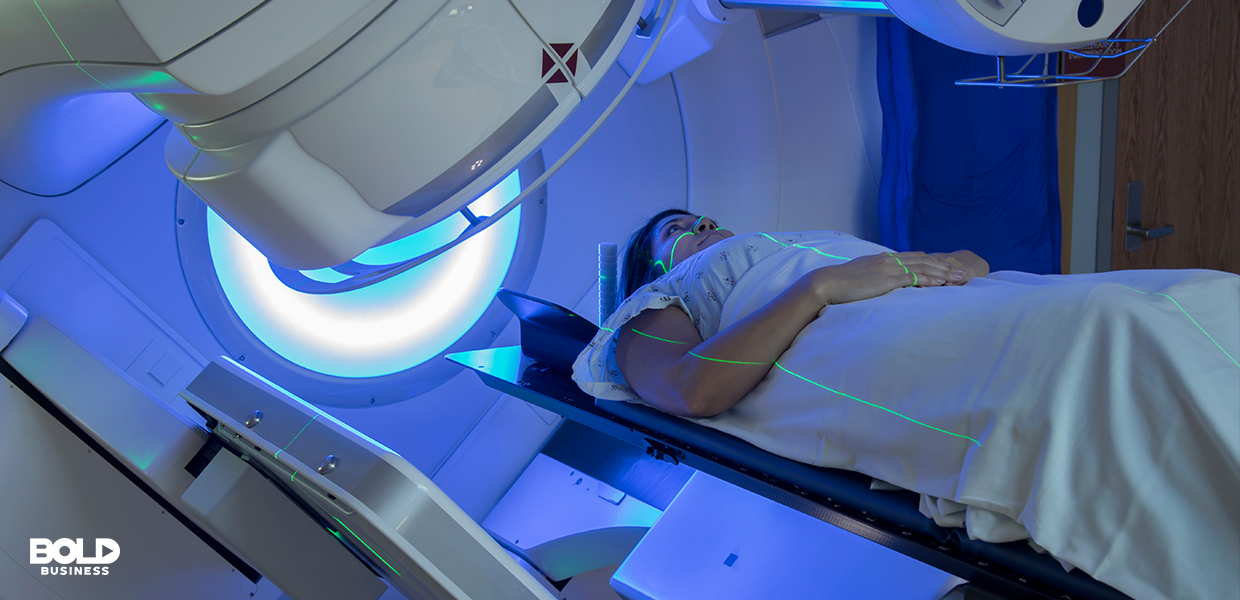 a photo of a patient lying down on a bed beside a machine while waiting to undergo radio frequency therapy