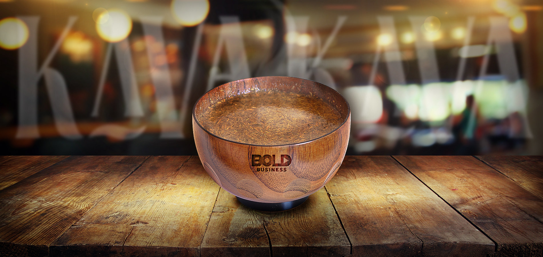 a photo of a Kava drink inside a coconut cup on top of a wooden table in relation to the Kava Craze and Matt Masifilo