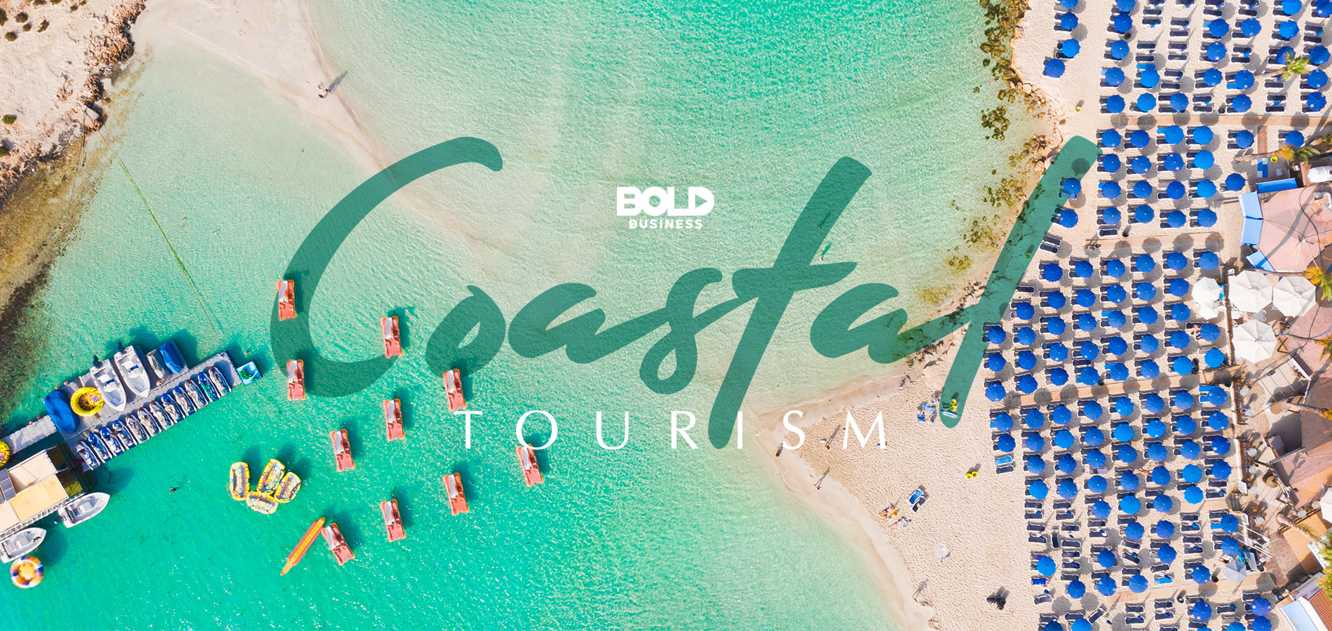 Aerial view of a beach that is filled with tourists and reclining chairs on the sand showing the reality of coastal tourism