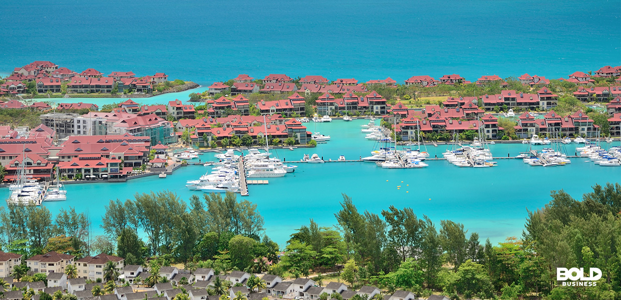 a photo of a coastal community in an island by the sea depicting the reality of coastal tourism and the need for sustainable tourism development