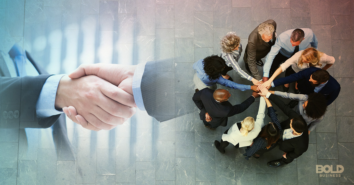 Two hands vs. a team huddle