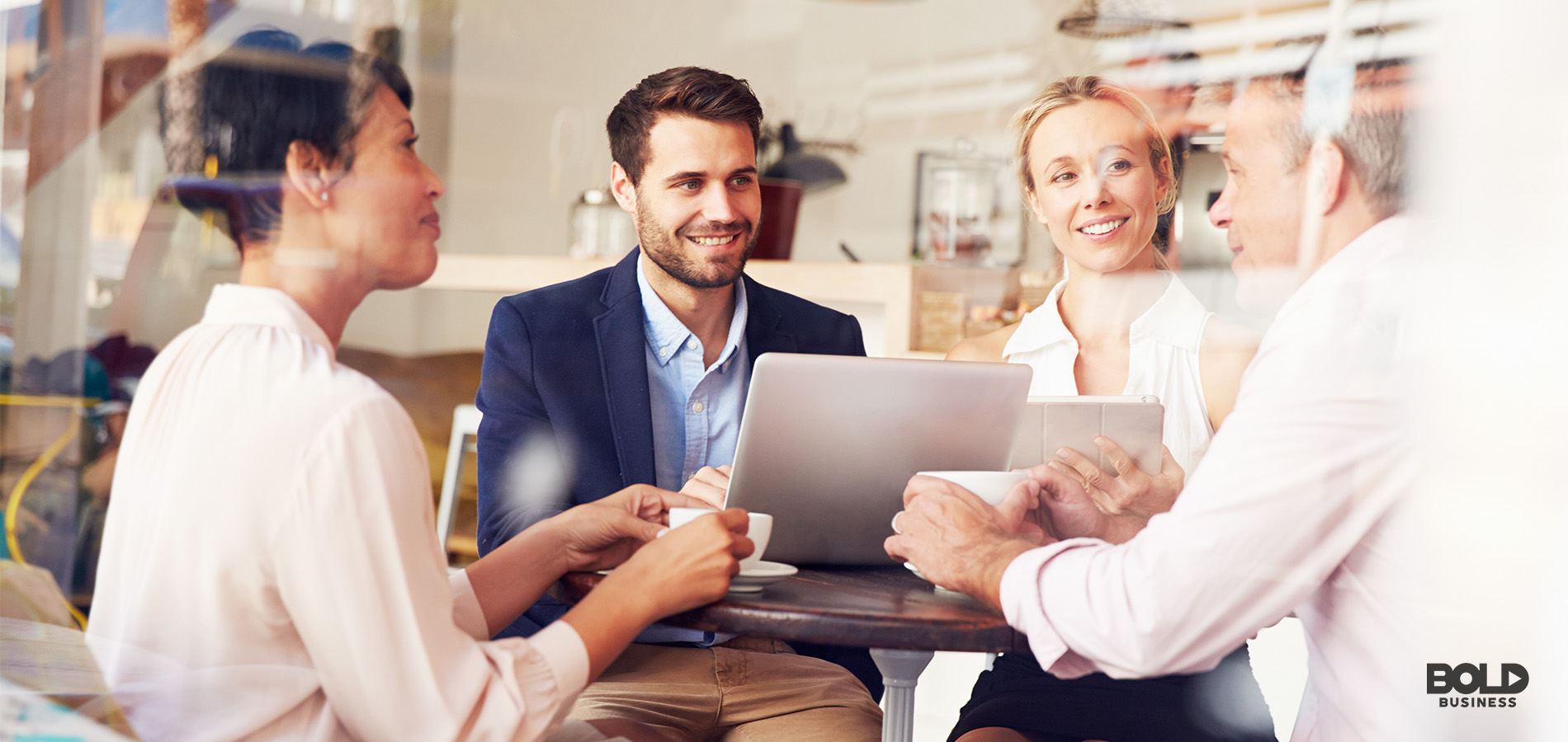 photo of a group of four founders at a round table talking about mental health management and entrepreneur depression