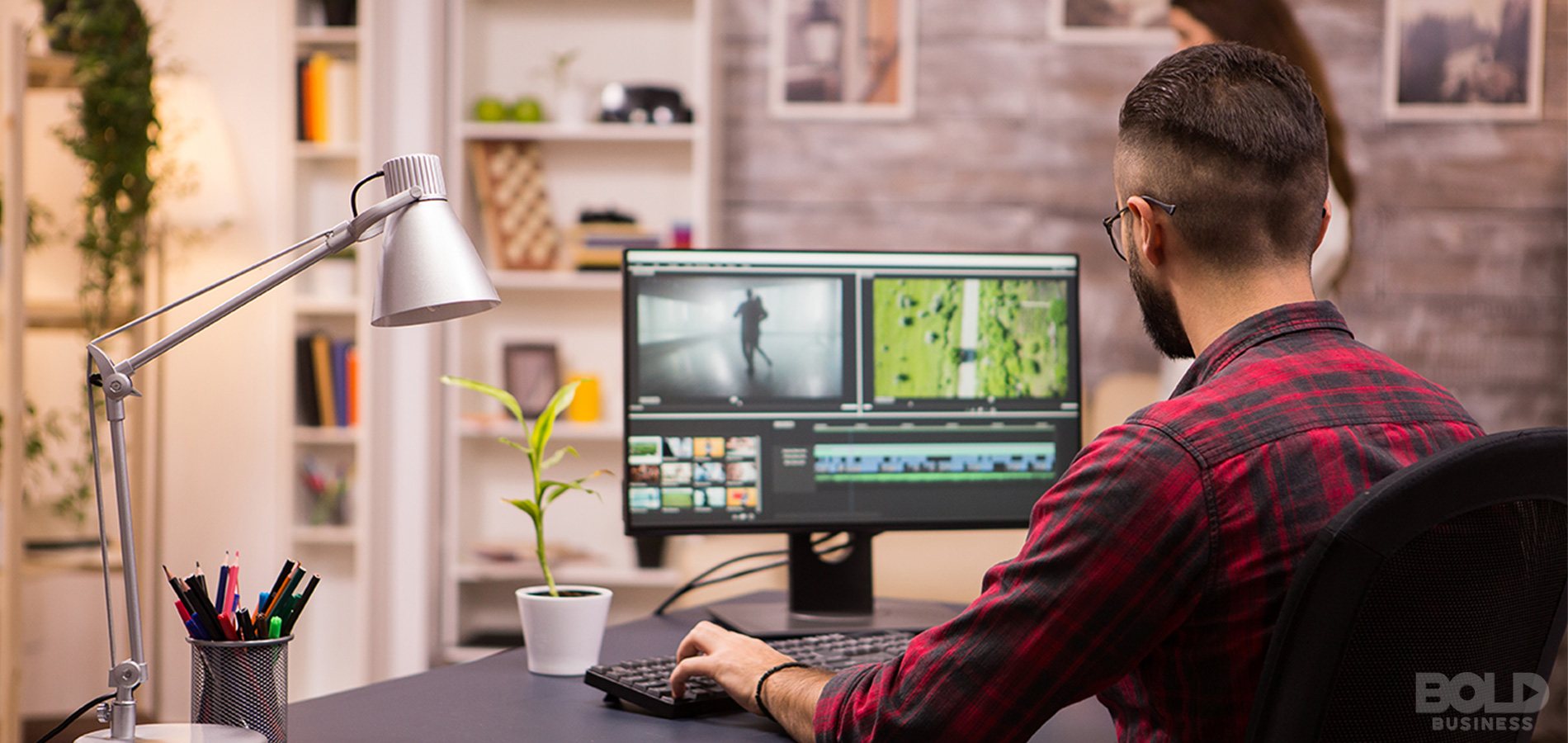 A dude with a weird hairstyle working from home