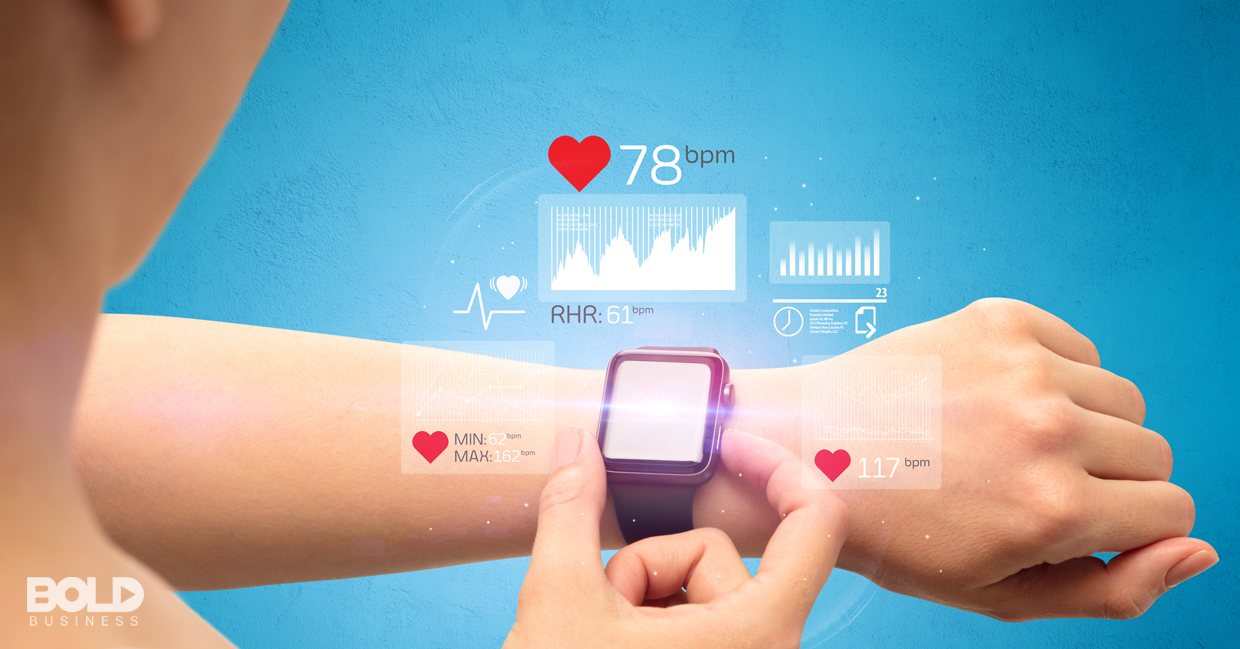 Someone checking their wearable health monitor