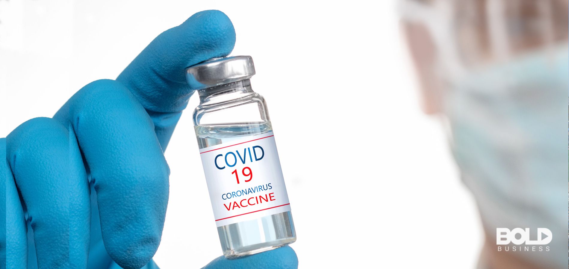 A doctor holding a vial of precious COVID vaccine