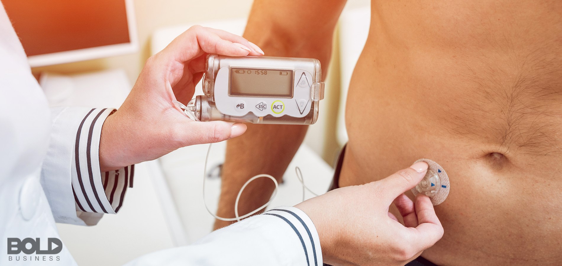 Some dude getting a wearable device attached to his stomach