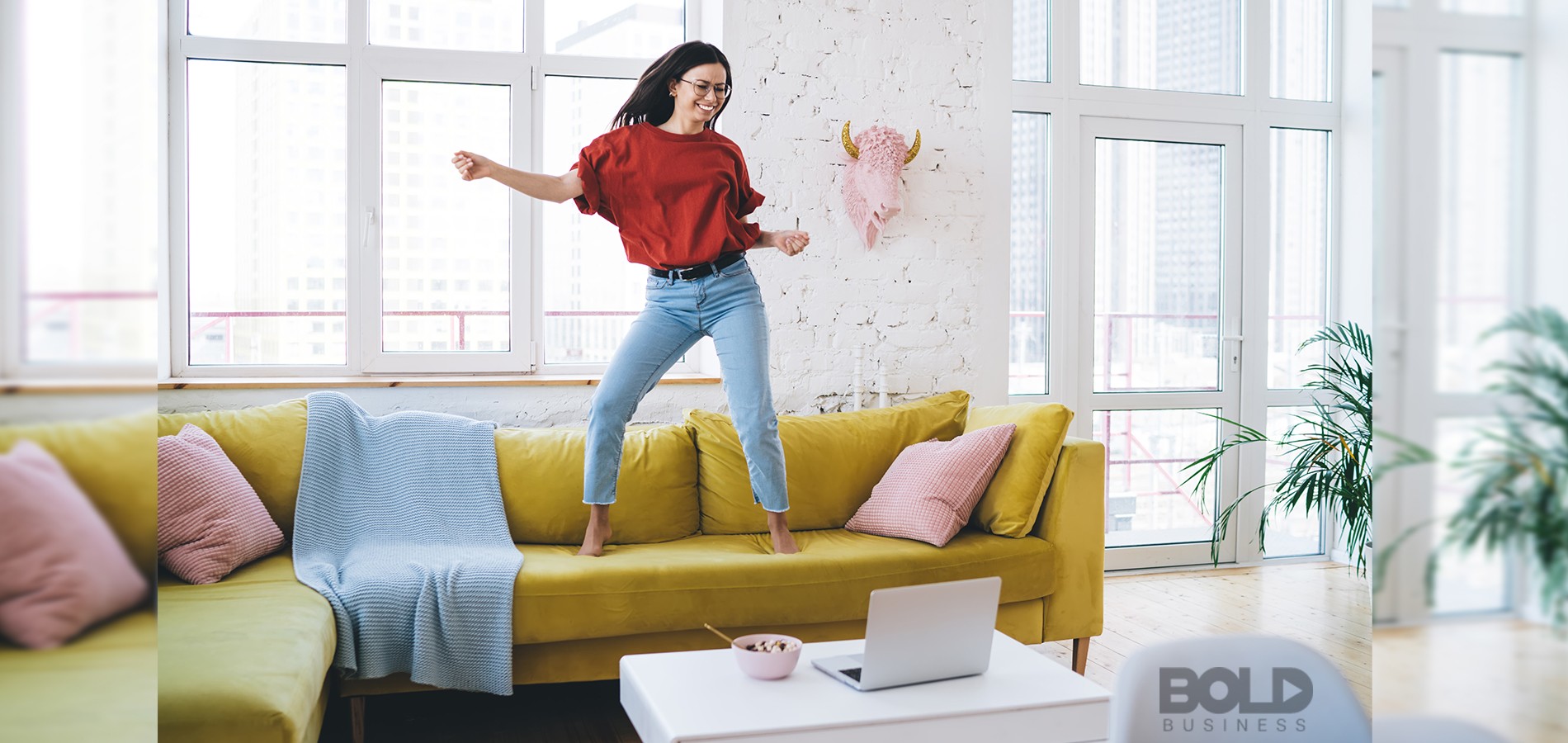 A woman dancing for a live audience on her laptop