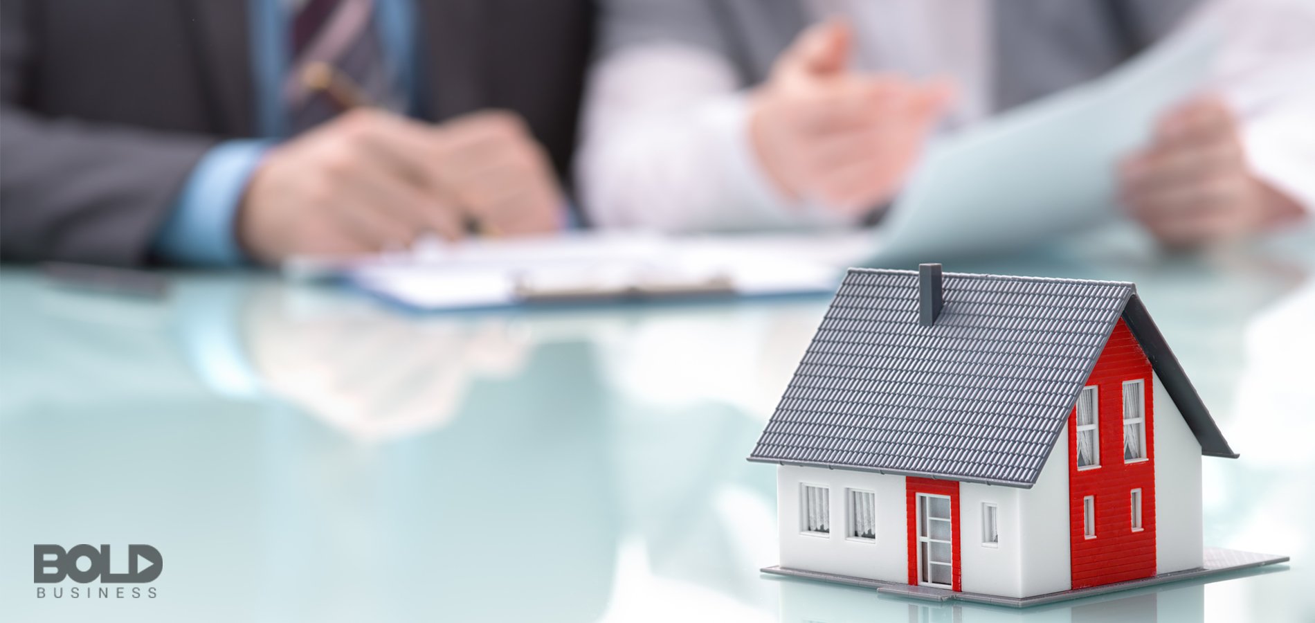 Some real estate agents closing on a very small house