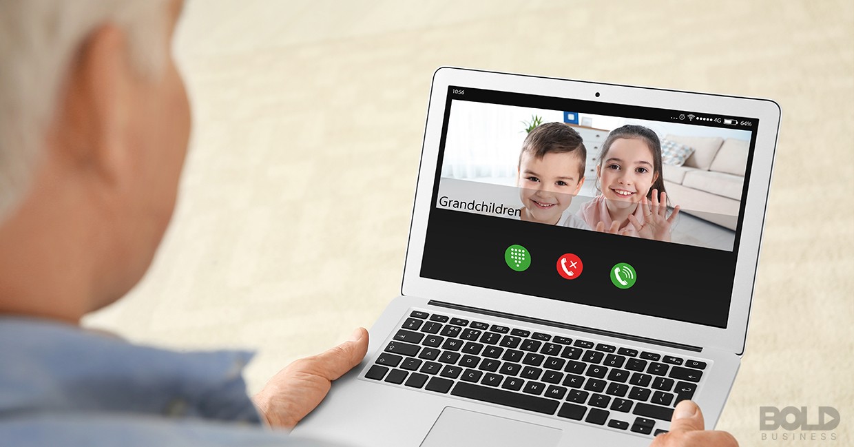 A grandparent videoconferencing with his grandkids