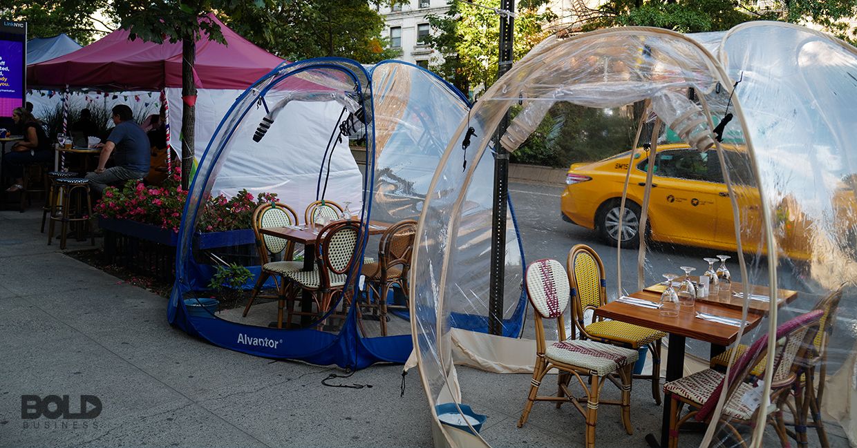 Some outdoor dining inside bubbles