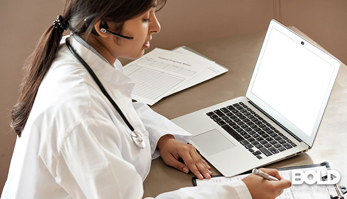 A doctor getting some medical training via her laptop