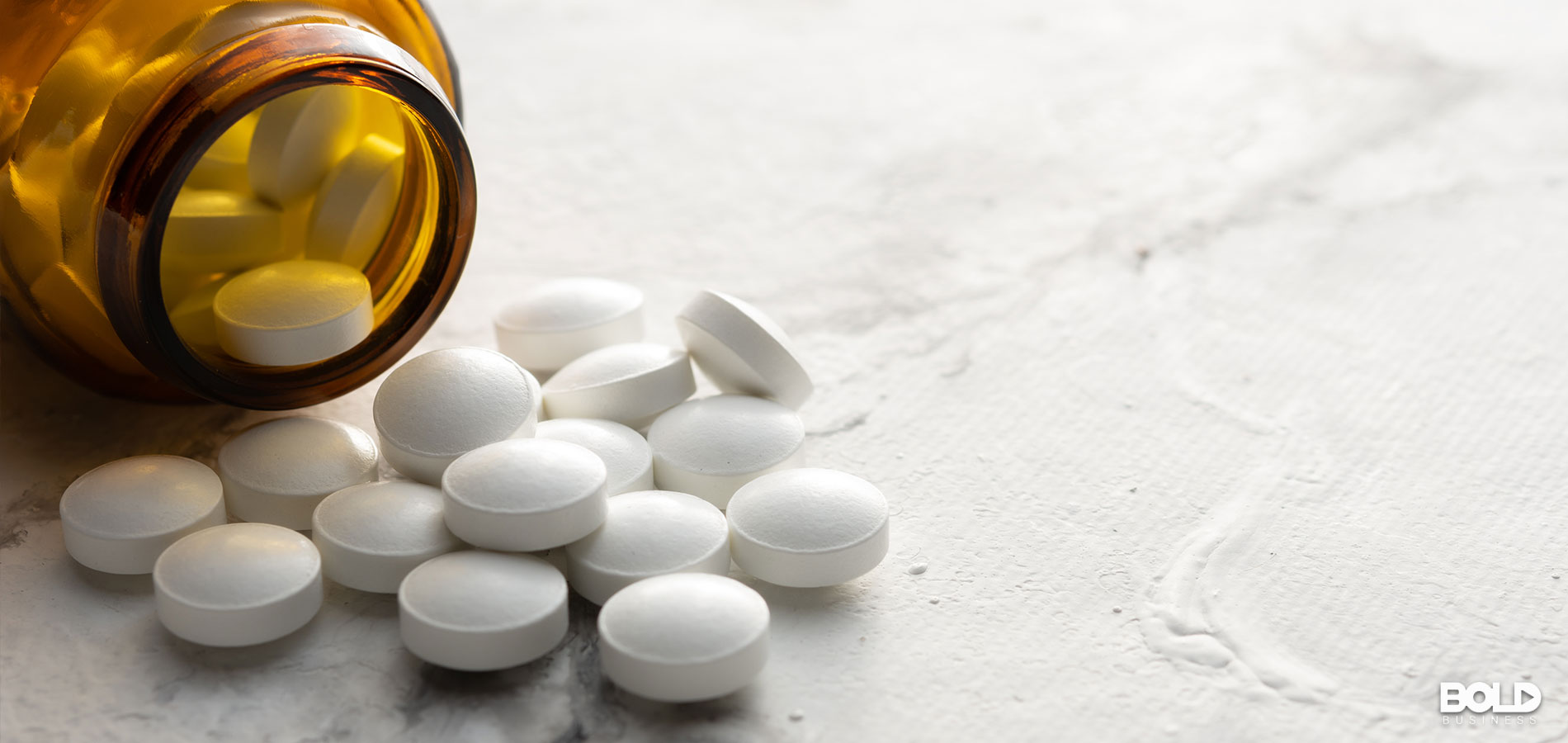 A bunch of pills trying to escape from a bottle