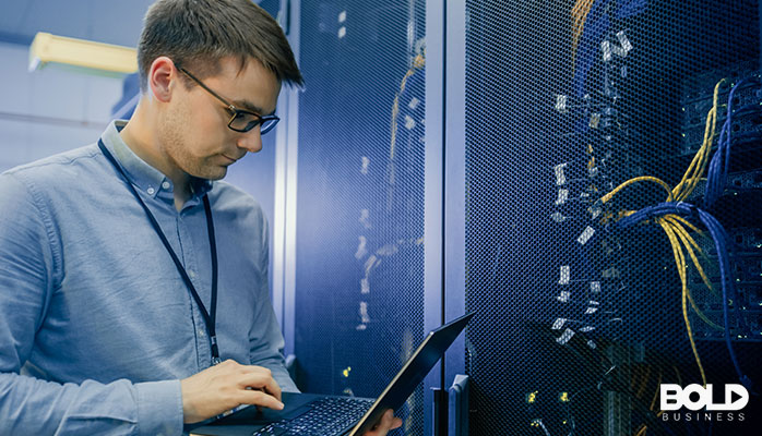 Some dude working on a server station