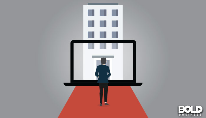 A cartoon of someone seeing a big building on a giant laptop