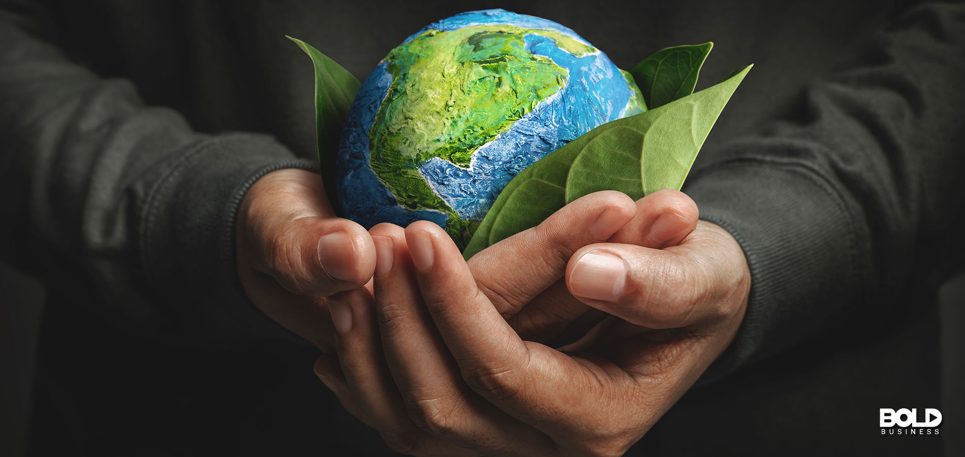 A gigantic person holding the Earth