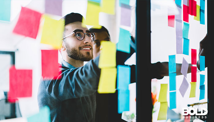 A dude looking at magical postits