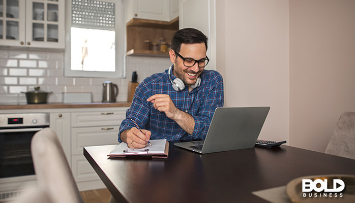 A dude working remotely in his kitchen