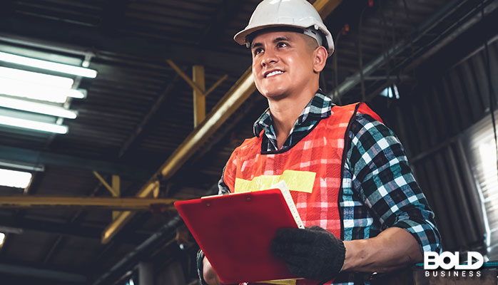An older factory worker dude in a hard hat