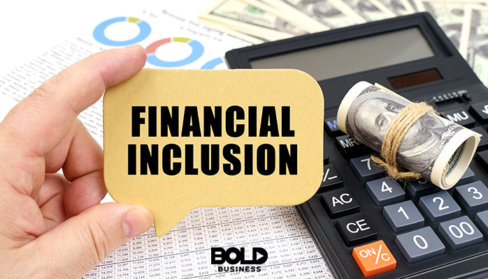 Someone holding up a financial inclusion card