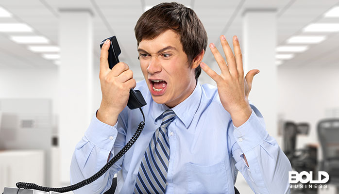 A dude screaming into his phone