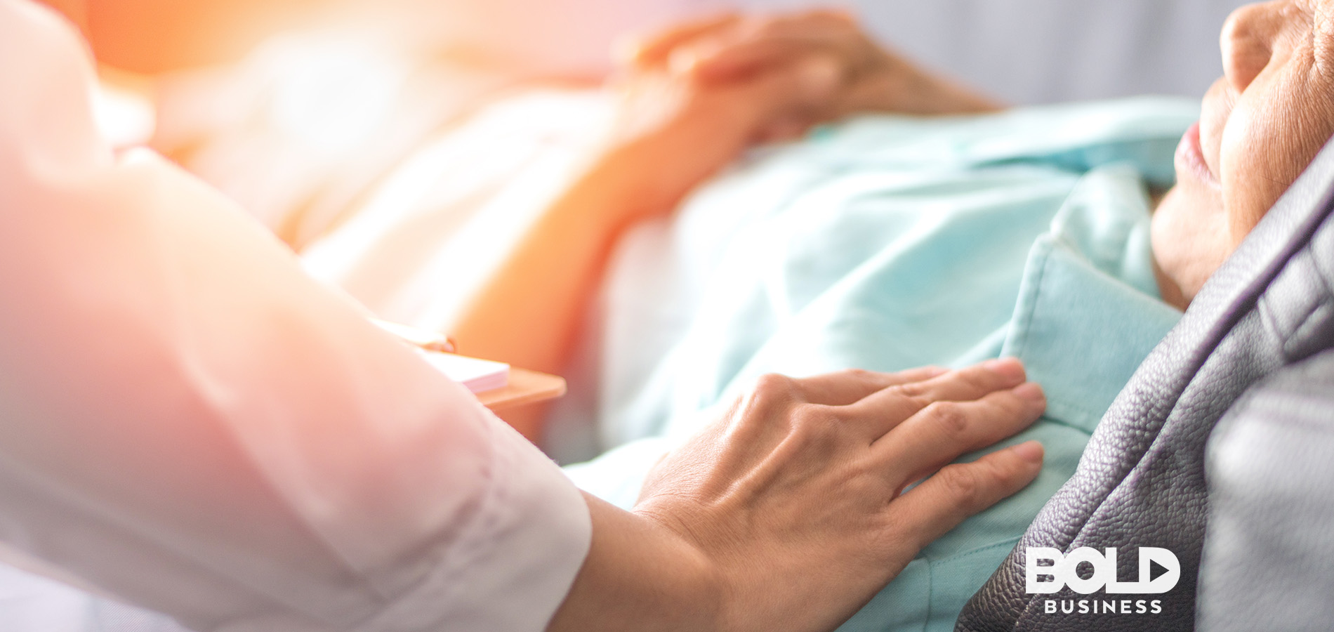 Someone laying hands of a dying person