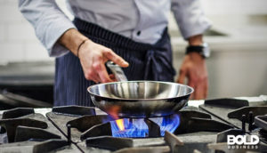Someone cooking despite bans on gas stoves