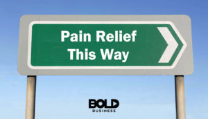 A sign pointing to the pain management business