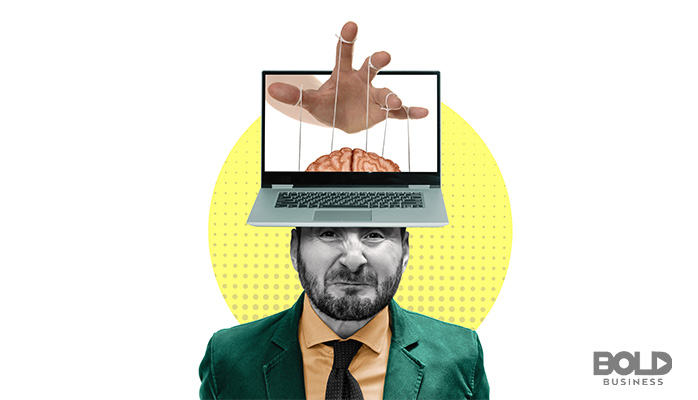 Some dude with a laptop and a hand for a head