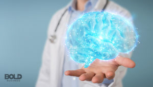 Someone holding a brain exemplifying health data for sale