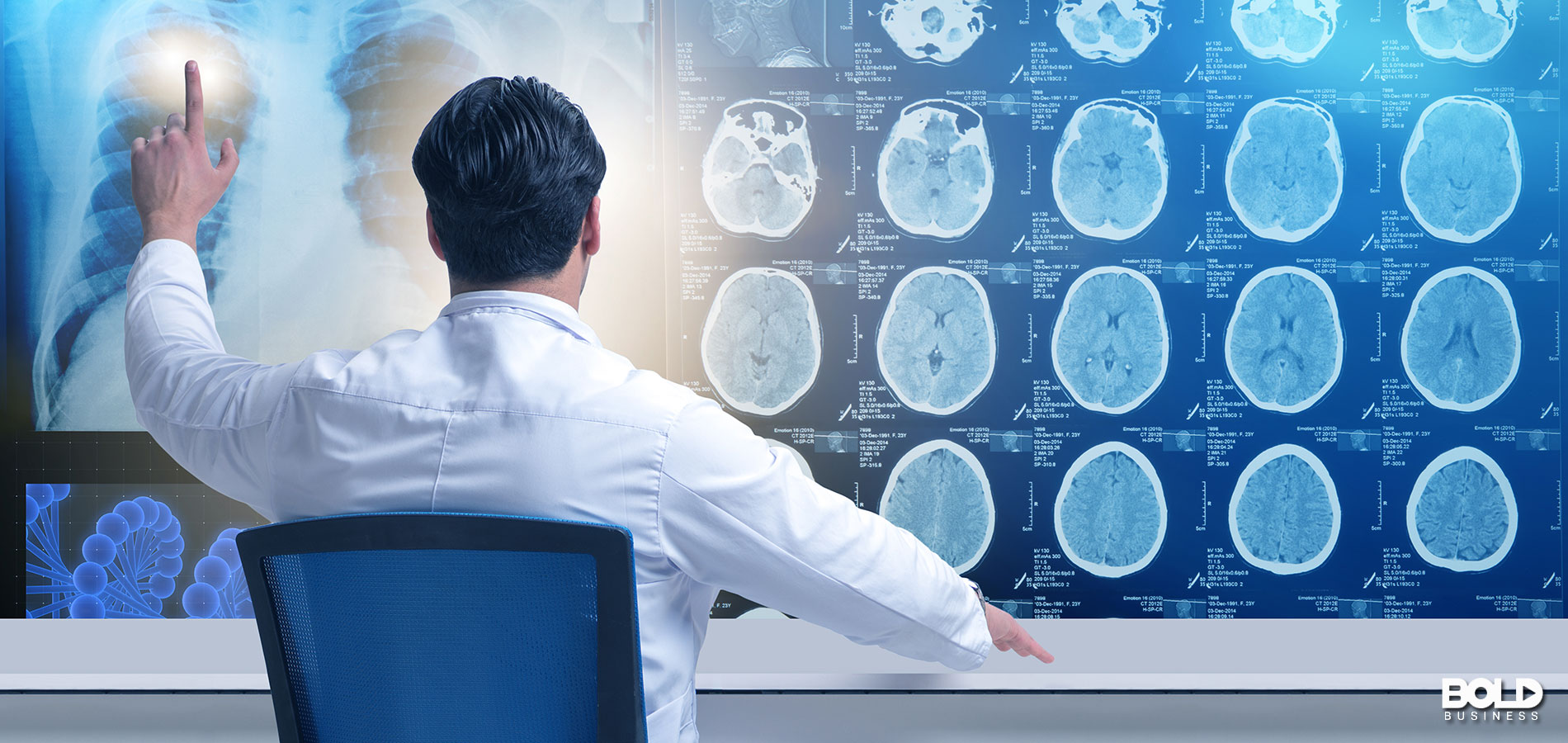 A doctor staring at his collection of brain pics