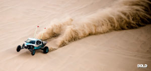 the rise in extreme tourism as shown by a dune buggy