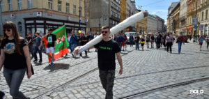 A dude walking through a cannabis boom town