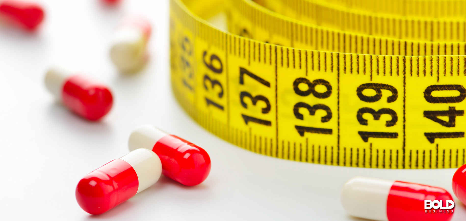a measuring tape showing the health benefits of obesity drugs