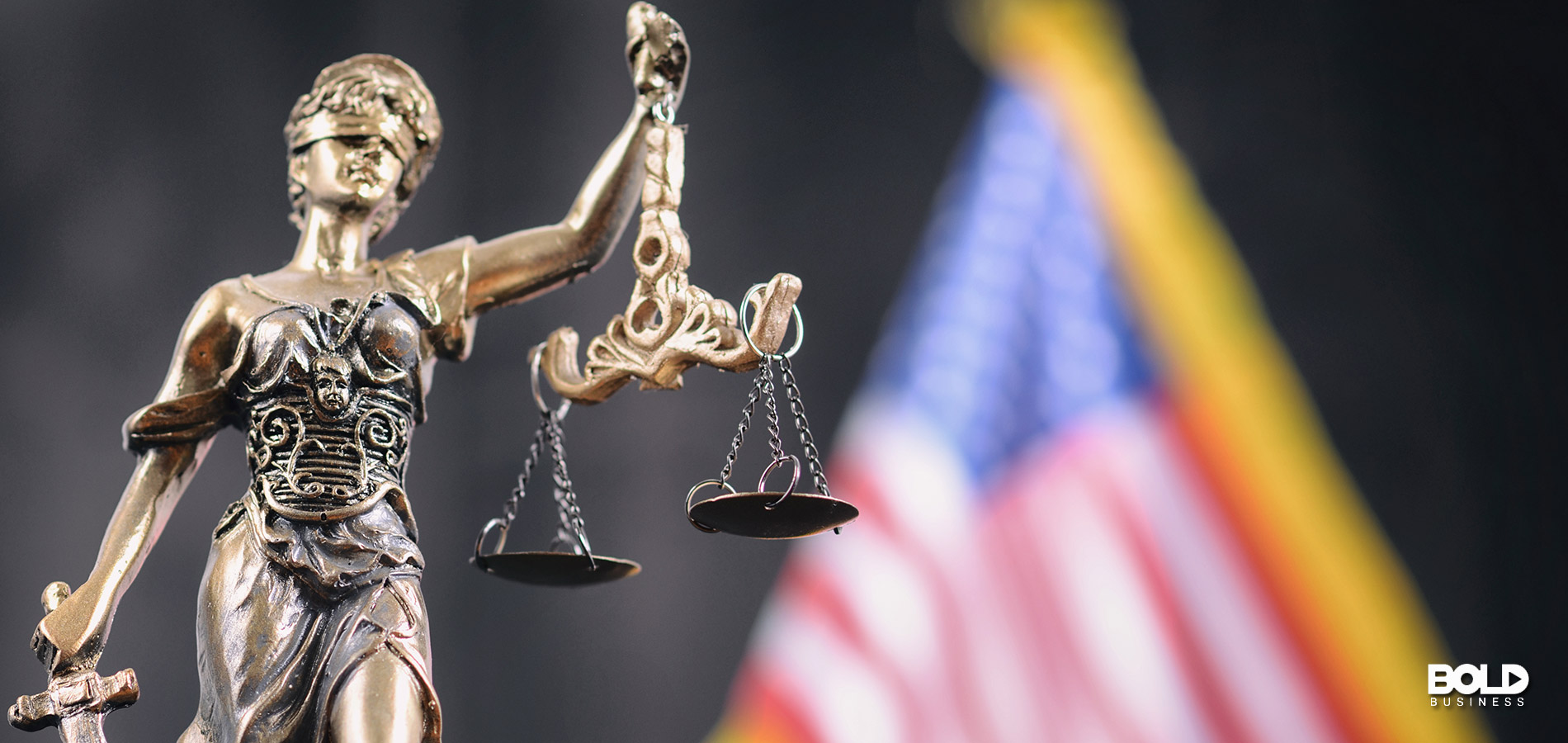 A blurry flag and some scales of justice