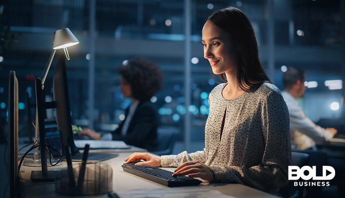 a woman happily working in some office