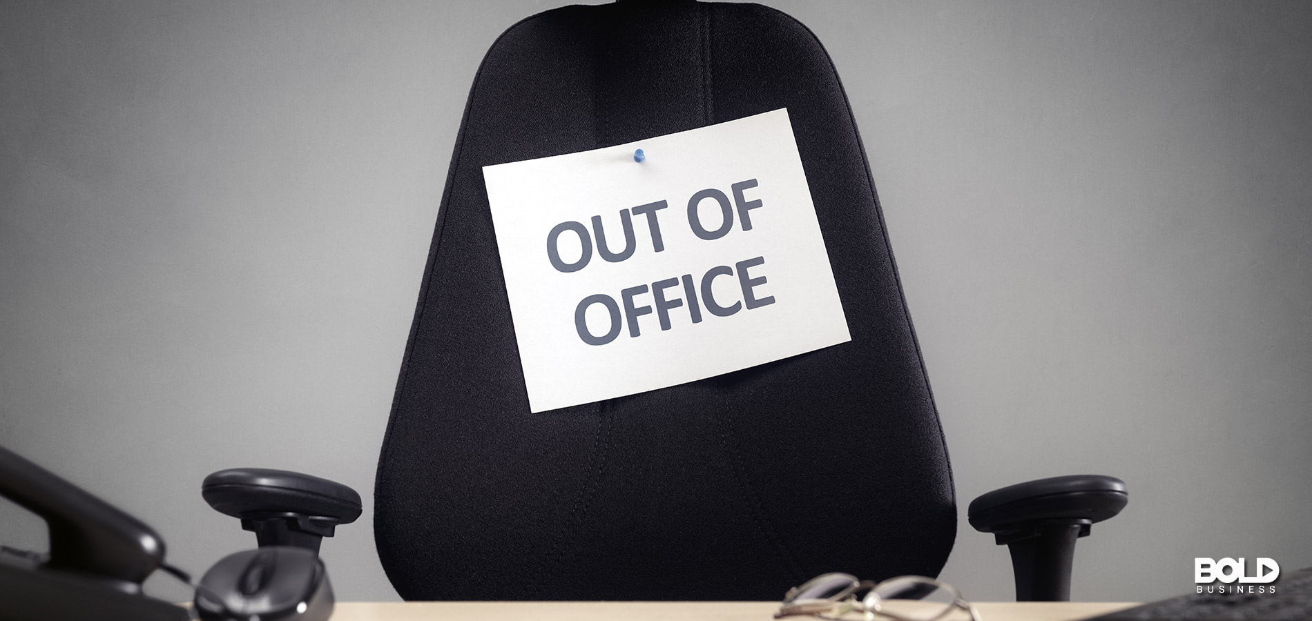 a swivel chair with an out of office sign