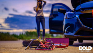 a woman dealing with an EV sales downturn