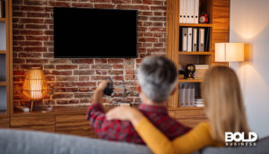 a dude watching streaming services adding ads