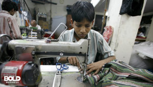 a kid doing illegal child labor