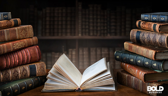 someone ancient books in a library somewhere